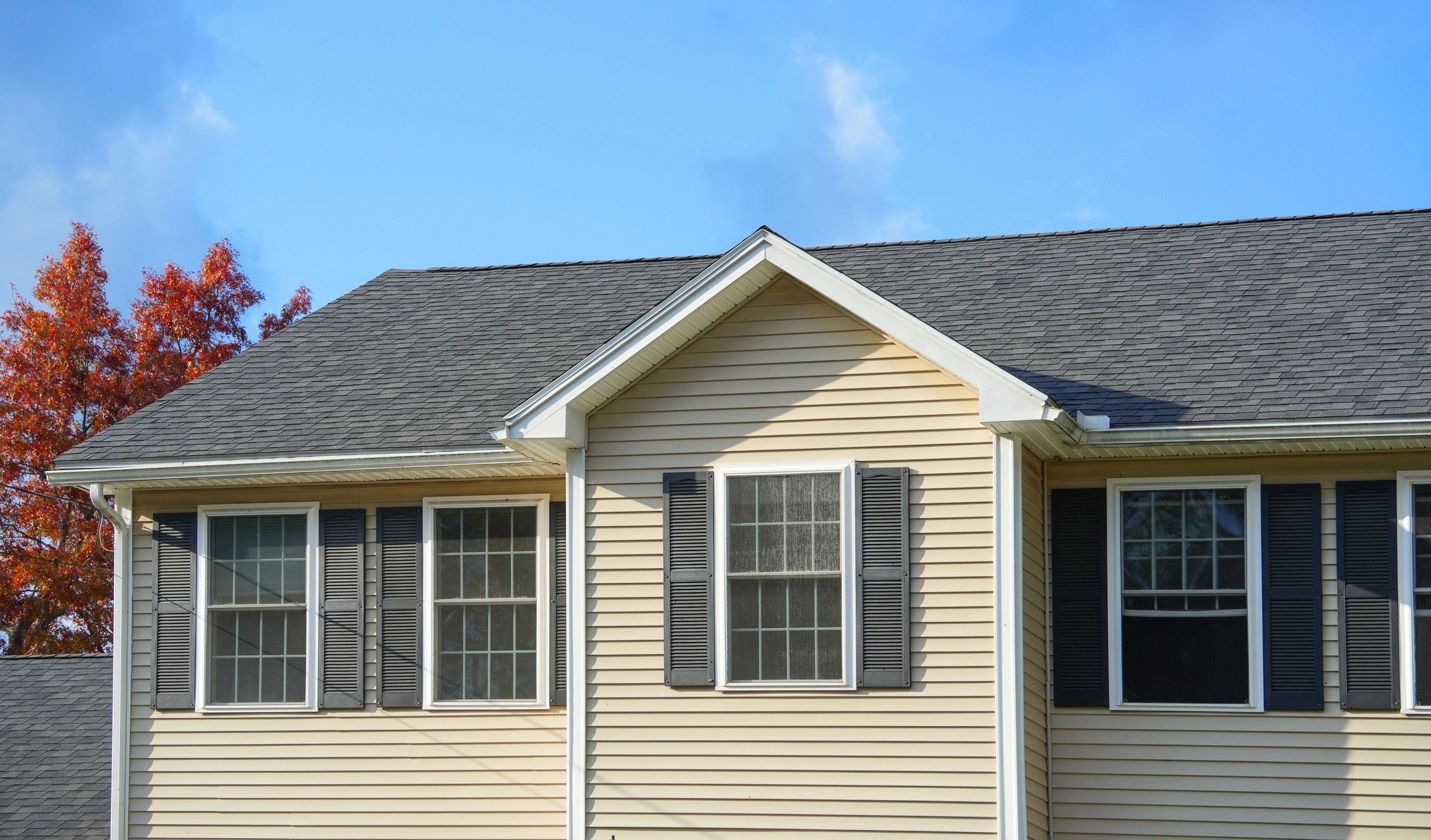 Client smiling with a new roof